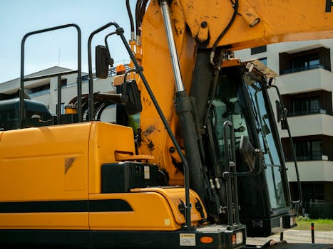 pexels photo 37528602 37528602 Close-up of a yellow excavator in an urban construction site in Wrocław, Poland.